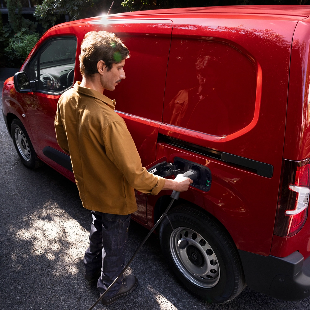 Man charging his red new ë-Berlingo Van