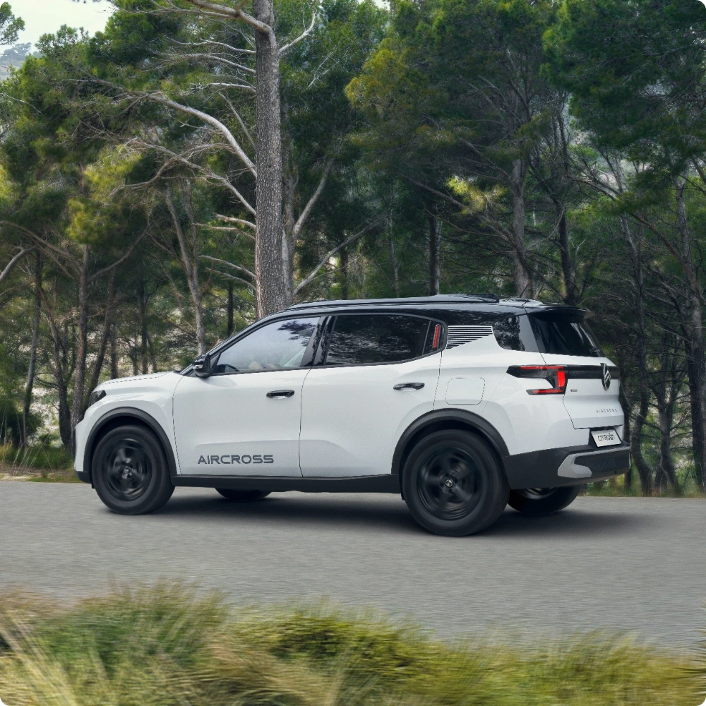 Side driving view of Citroën C3 Aircross Hybrid SUV highlighting smooth electric‑assisted performance for confident, versatile and affordable mobility.
