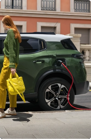 Side charging view of Citroën ë‑C3 Aircross electric SUV showcasing easy plug‑in access for convenient, efficient and affordable mobility.