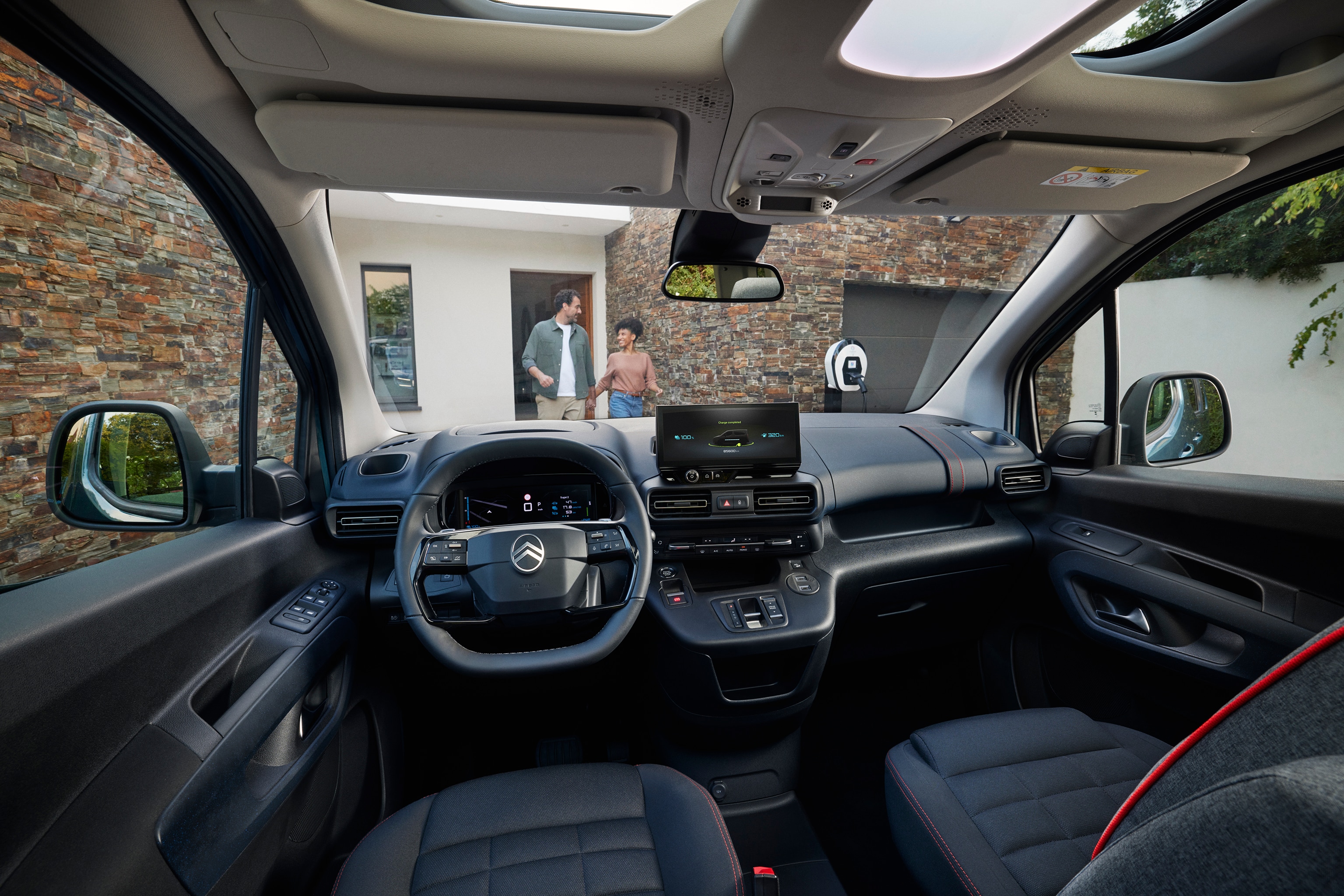 Front interior view ë-Berlingo showing panoramic roof, comfort, space, connectivity and improved everyday driving experience