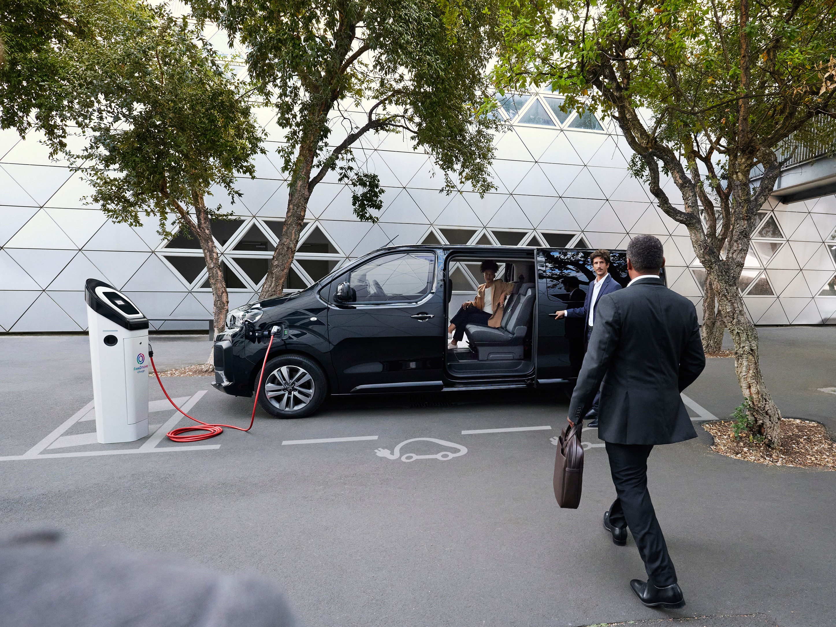 SpaceTourer charging with people entering it